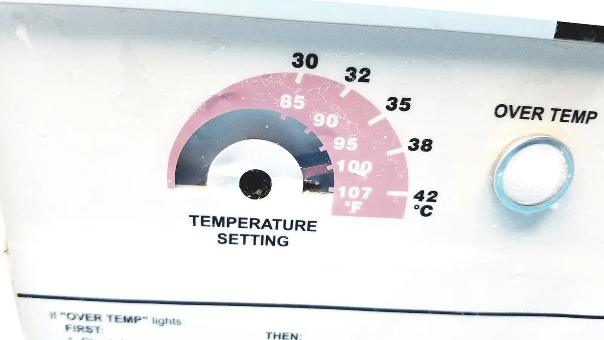 White plastic temperature dial with pink and gray fahrenheit celsius markings on gaymar t pump tp500c heat therapy pump