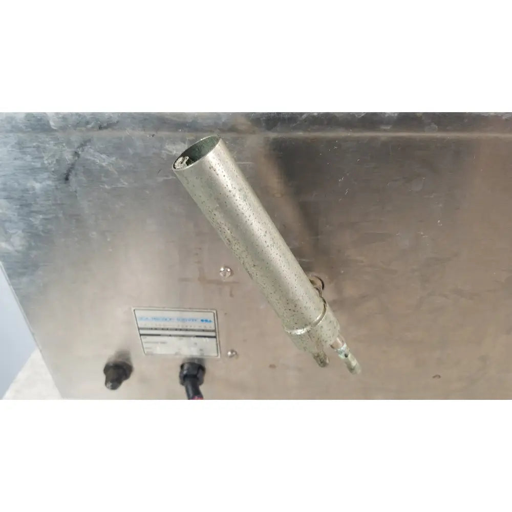 A weathered metallic cylindrical pipe with corrosion on the precision scientific dubnoff metabolic shaking incubator
