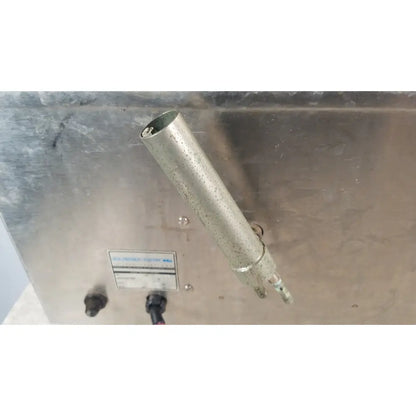 A weathered metallic cylindrical pipe with corrosion on the precision scientific dubnoff metabolic shaking incubator