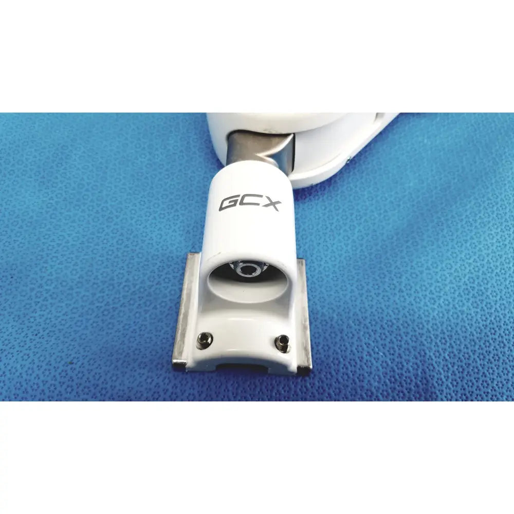 White gcx brand marine winch with sleek cylindrical body and metallic mounting bracket in gcx vhm variable height arm