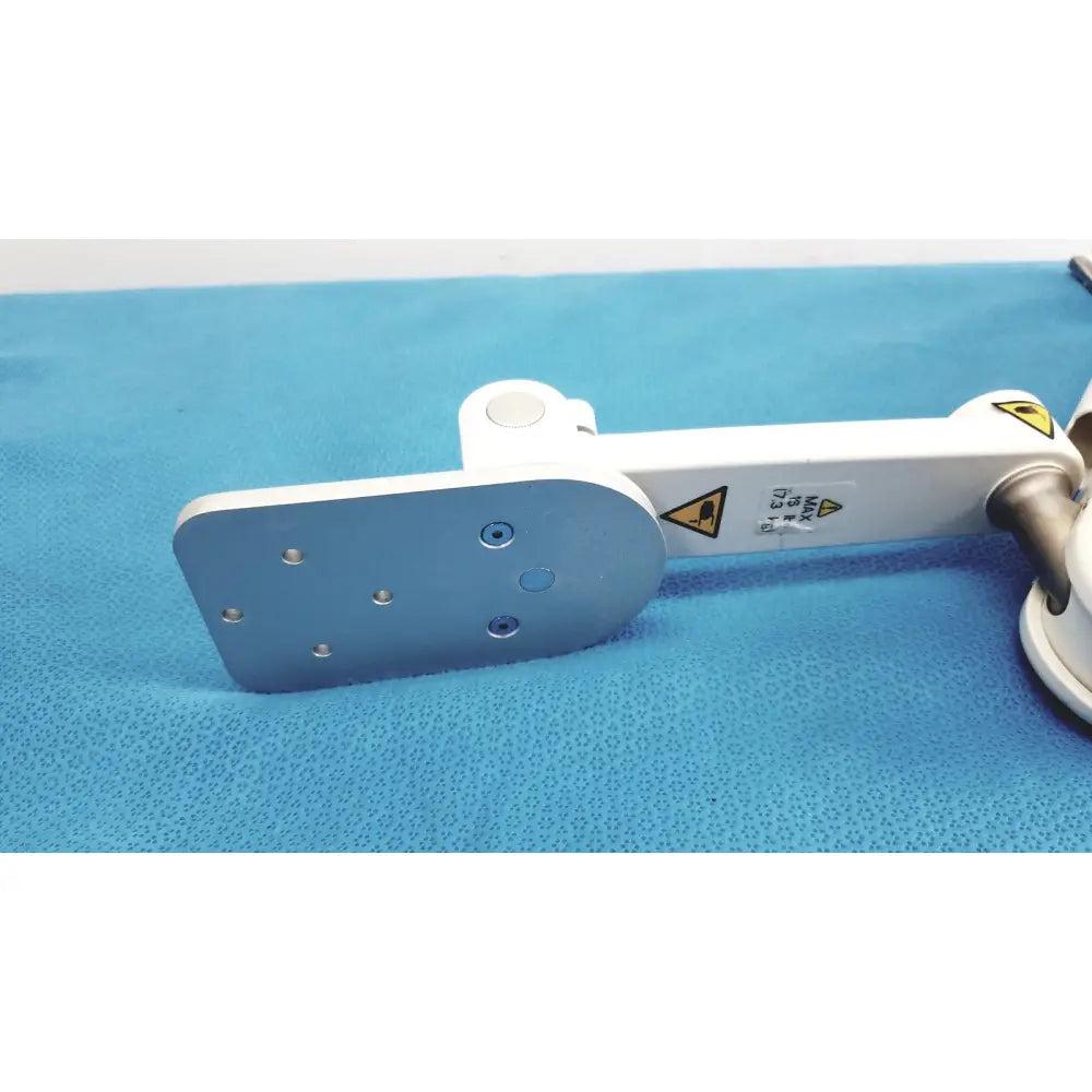 White and silver gcx vhm variable height arm with flat metallic plate featuring six screw holes for secure mounting