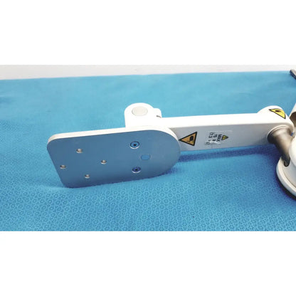 White and silver gcx vhm variable height arm with flat metallic plate featuring six screw holes for secure mounting