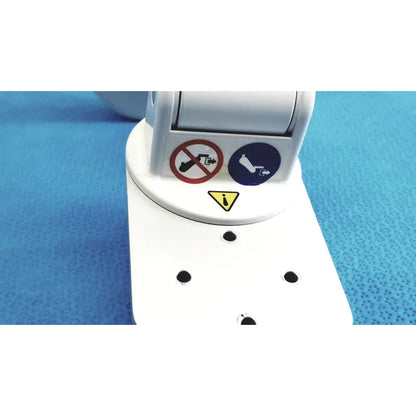White plastic gcx vhm variable height arm medical device with warning labels and mounting holes visible on back side