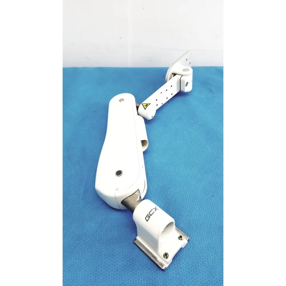 White plastic and metal gcx vhm variable height arm with adjustable monitor support and gcx branding on the base