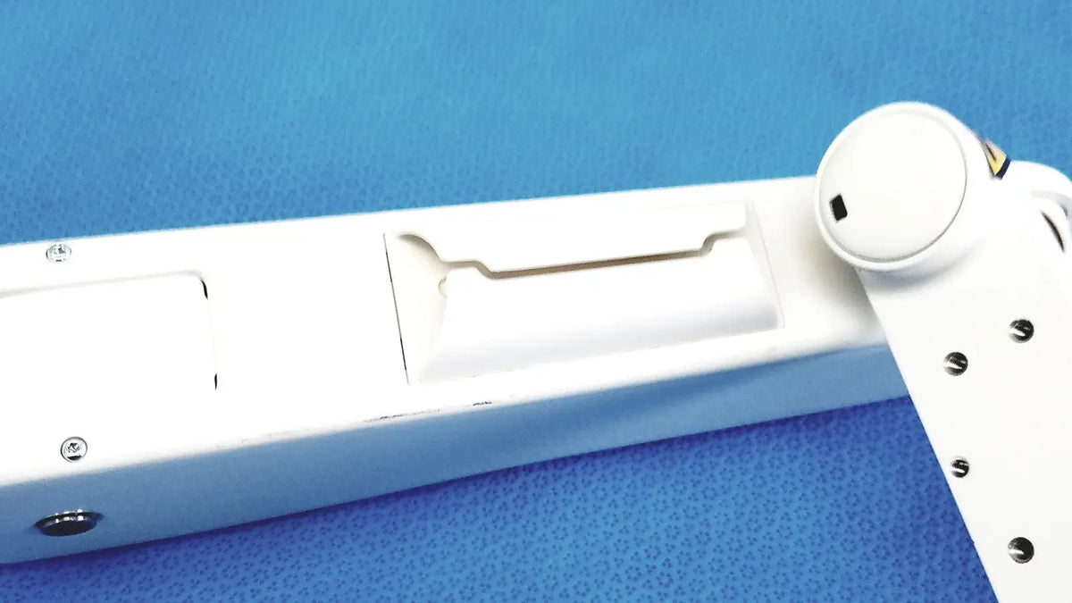 White gcx vhm variable height arm with sleek segmented design and metallic screws along its joints