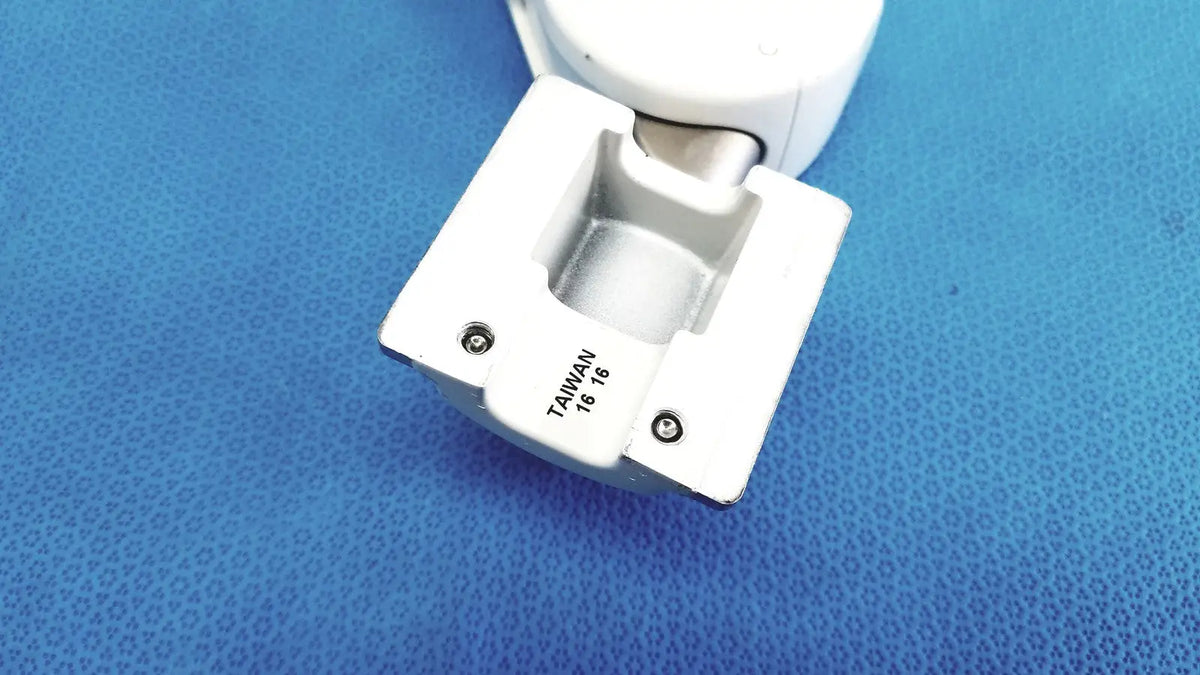 White plastic hinge with metallic silver pivot and taiwan 16/8 engraving on base of gcx vhm variable height arm
