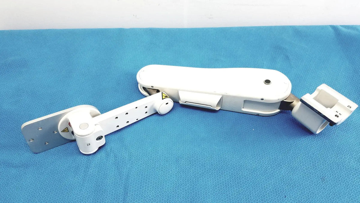 White plastic gcx vhm variable height arm surgical support with adjustable joints and metal plate attachment