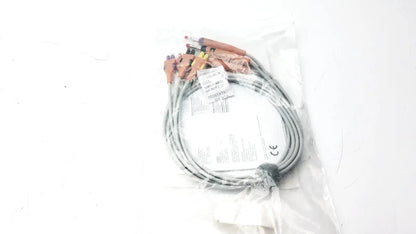 Gray coiled lead wire set add on banana aha heim with multiple connectors packaged in clear plastic for electrical use
