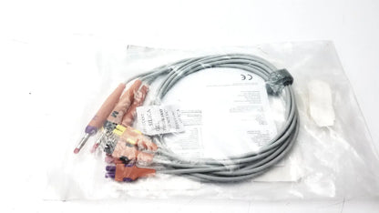 Gray coiled lead wire set with orange and purple banana aha heim connectors packaged in clear plastic for wire set add use