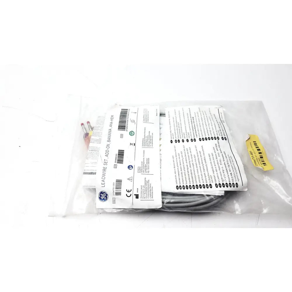 Gray ge 2104751-001 lead wire set add on banana aha heim in clear plastic packaging with printed labels and yellow barcode sticker