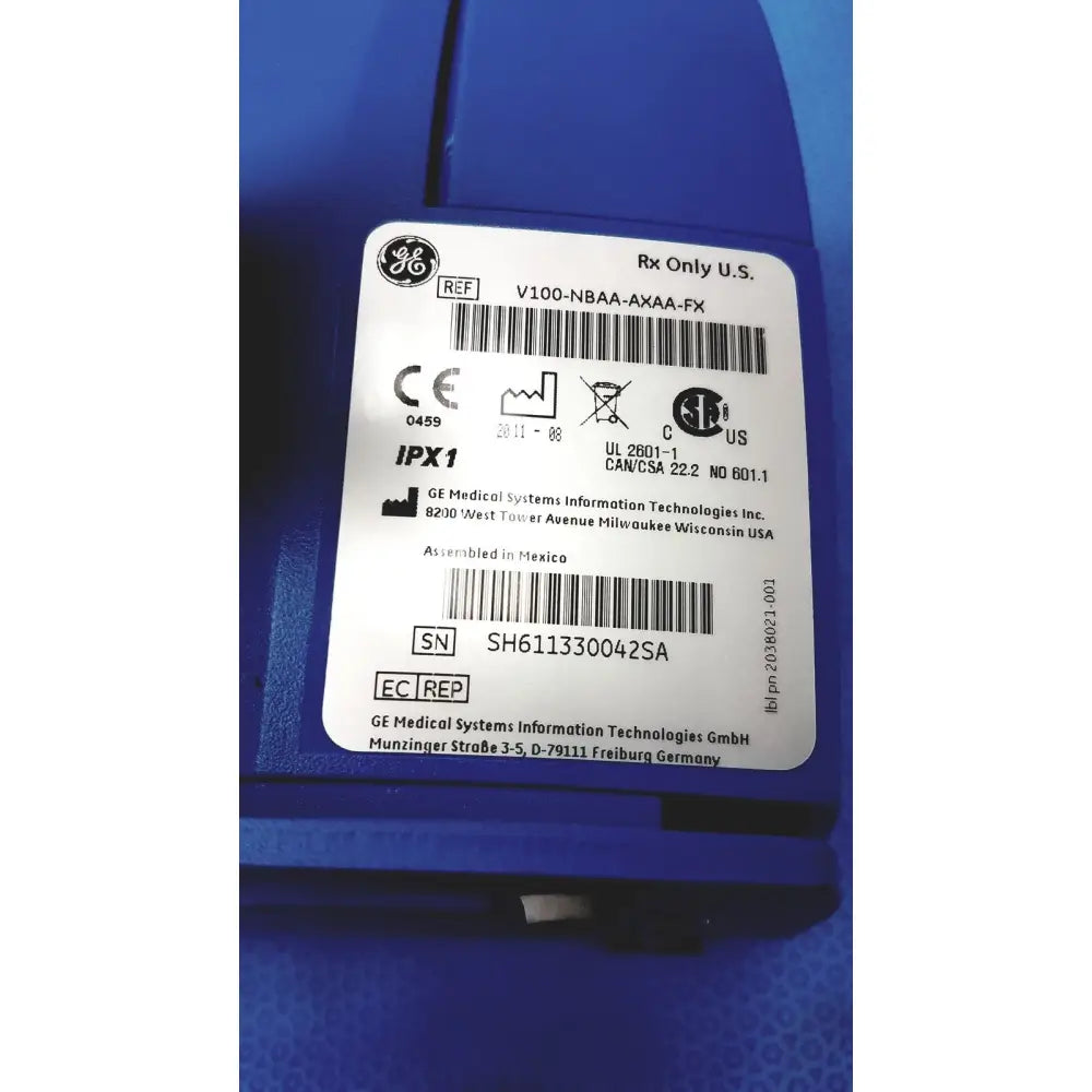 Blue ge carescape dinamap v100 vital signs monitor with white certification label and serial number visible on back side