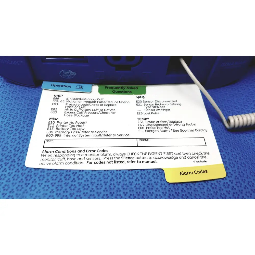 White medical device alarm code reference sheet with operation and faq sections for carescape dinamap v100 vital signs monitor