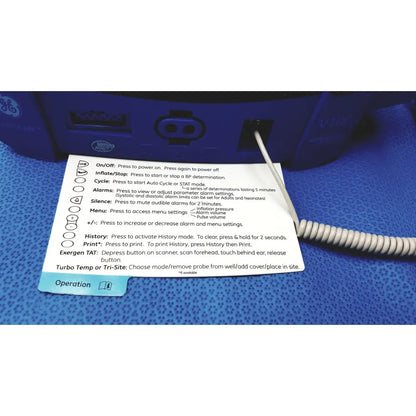 Blue ge carescape dinamap v100 vital signs monitor with white coiled cable and instruction card placed on surface