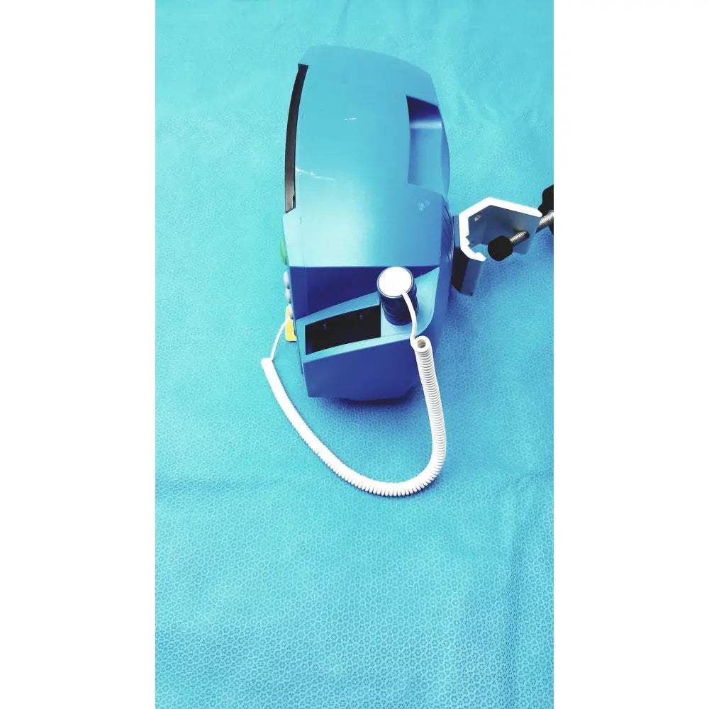 Blue carescape dinamap v100 vital signs monitor with white coiled cable and black clamp attachments for cuff use