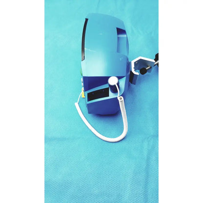 Blue carescape dinamap v100 vital signs monitor with white coiled cable and black clamp attachments for cuff use