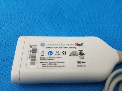 White plastic pulse oximeter labeled masimo rainbow set for ge carescape spo2 pulse co-oximetry parameter ref 4184