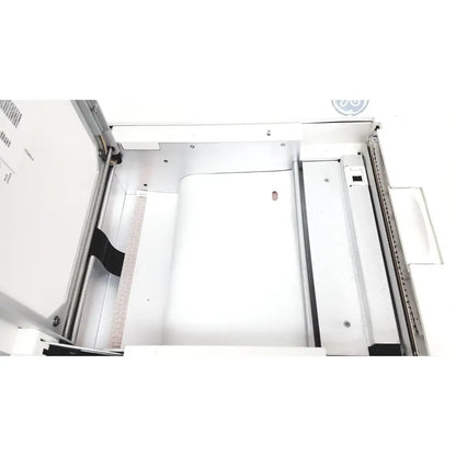 Interior view of white GE case stress test exercise testing unit showing metallic frame and paper tray components