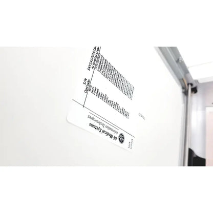 White rectangular label with black text and ge medical systems logo on the back of a ge case stress test cardiac exercise testing unit