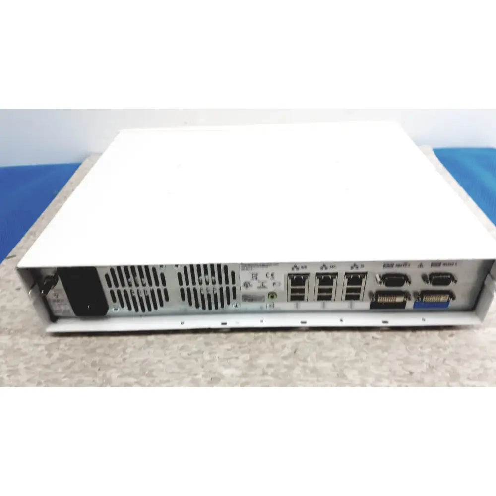 White rectangular server unit with silver rear panel and multiple network ports of ge cic pro mp100d central station
