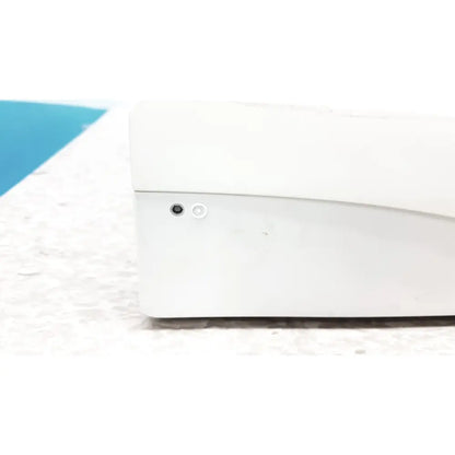 White plastic GE cic pro mp100d central station device with black circular port and white side button for monitoring