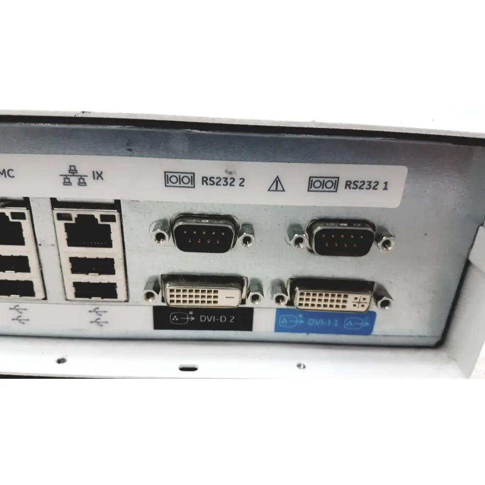 The rear panel of a silver metallic ge cic pro mp100d central station featuring multiple ports including dvi and rs232