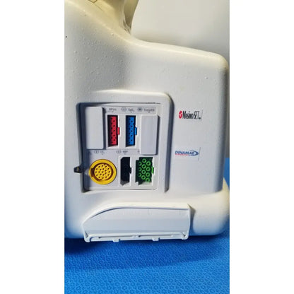 White plastic GE dash 5000 patient monitor ECG backside with multiple colored ports including red blue green and yellow connectors