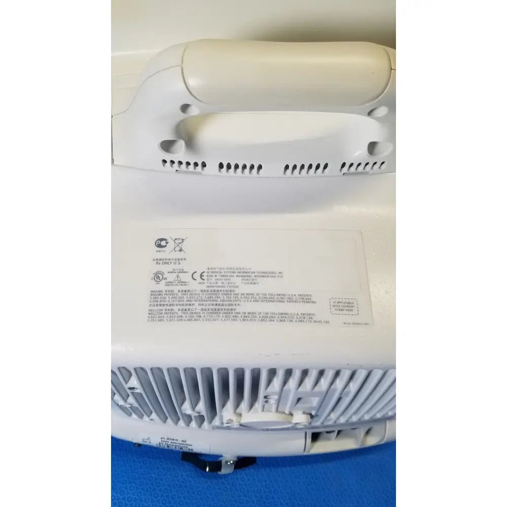 White plastic air purifier with vented grille and certification labels on back panel of ge dash 5000 patient monitor ecg