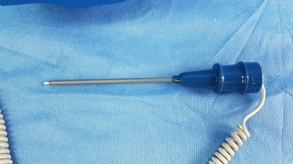 Blue-handled medical probe with metallic shaft and coiled white cable for GE Dinamap vital signs monitor with nibp cuffs and power adapter