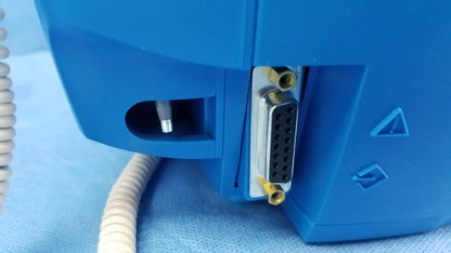 Blue ge dinamap v100 vital signs monitor back with silver d-sub connector and yellow locking screws for nibp cuffs and power adapter