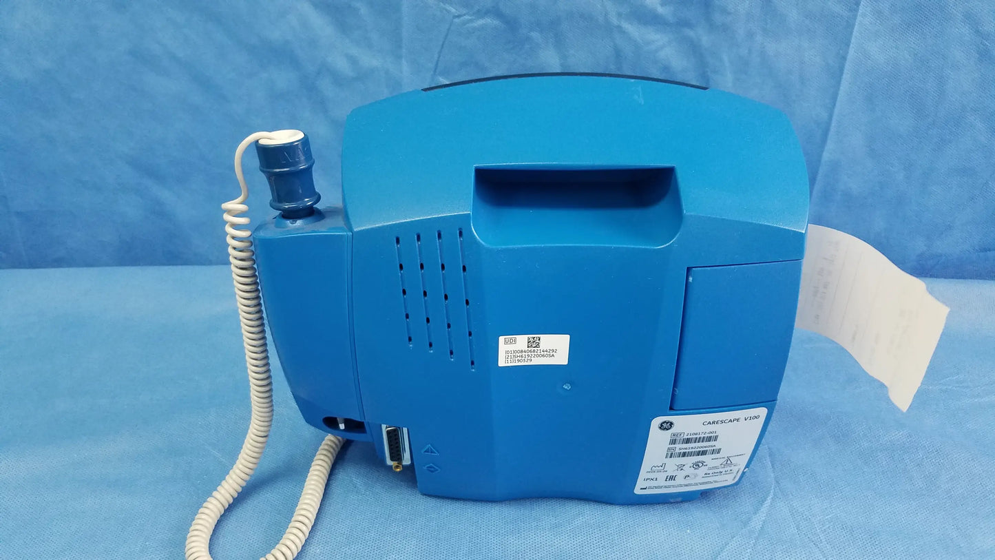Blue GE Dinamap V100 vital signs patient monitor with nibp cuffs, power adapter, coiled handset, and paper output slot