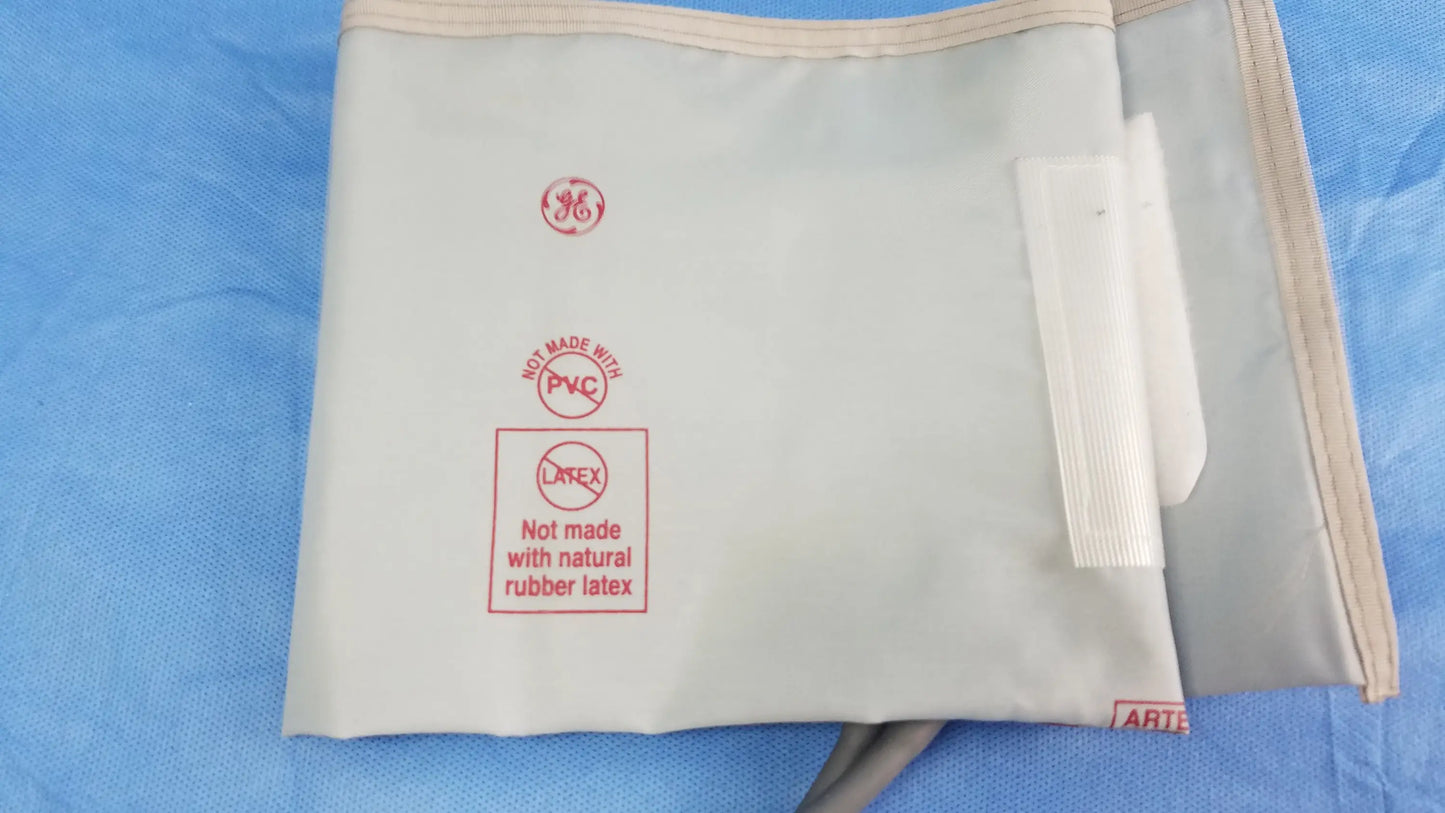 Beige non-latex nibp cuff with ge logo and not made with pvc label for vital signs monitor with power adapter