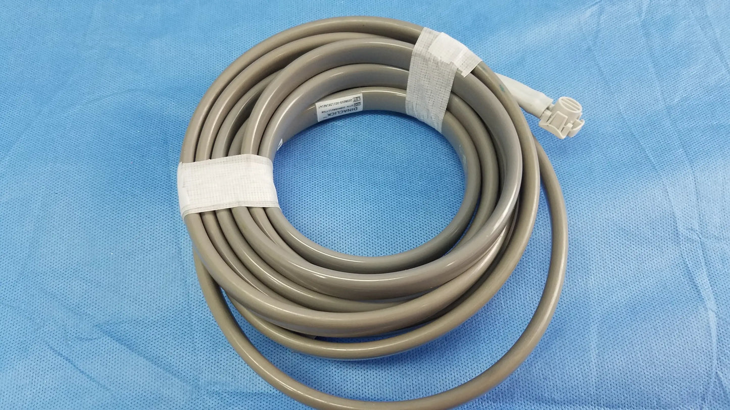 Gray coiled medical cable with white connector and tape securing loops for ge dinamap v100 vital signs monitor accessories including nibp cuffs and power adapter