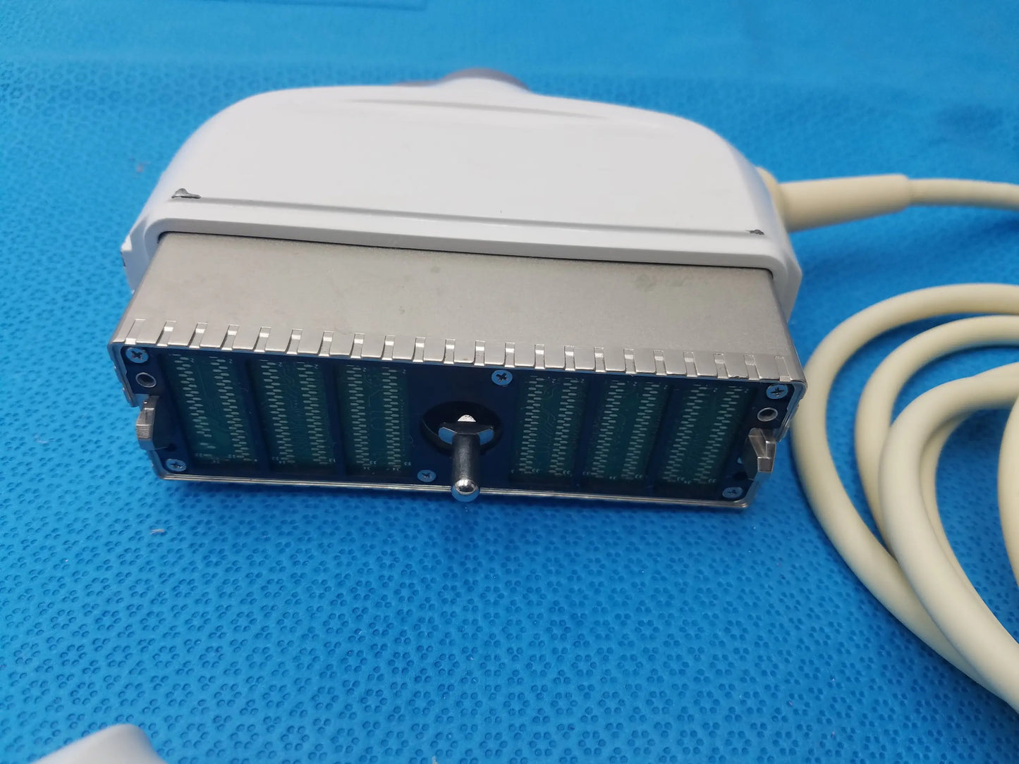 White and silver ge healthcare be9cs-d bi-plane micro convex ultrasound probe with rectangular multi-pin connector housing