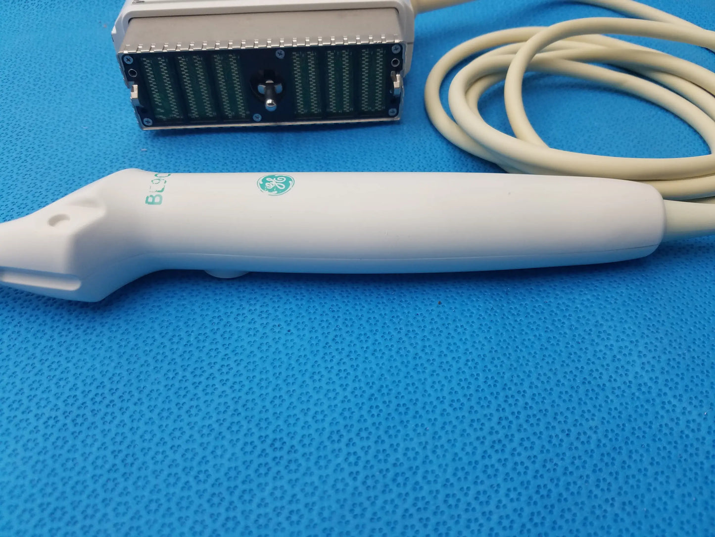 White GE Healthcare BE9CS-D bi-plane micro convex ultrasound probe with sleek ergonomic design and green branding