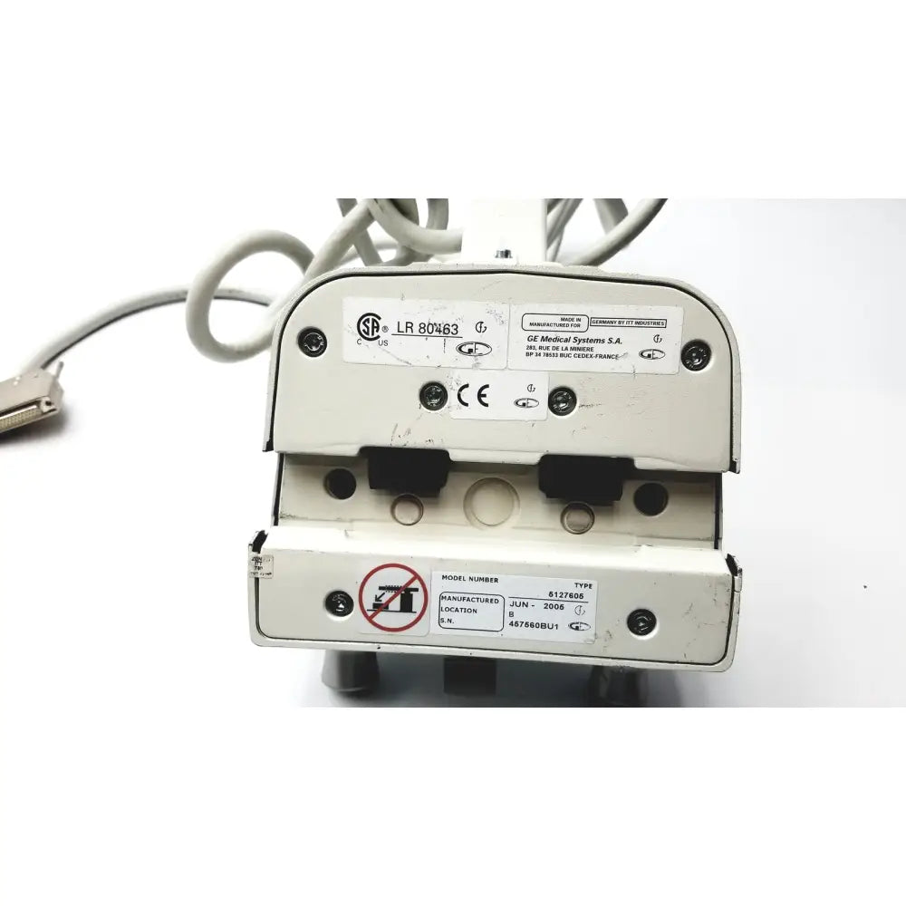White plastic healthcare innova smart handle with black rubber and metallic connectors labeled ge medical systems s.a