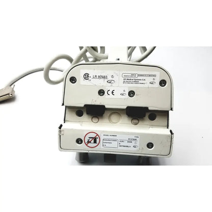 White plastic healthcare innova smart handle with black rubber and metallic connectors labeled ge medical systems s.a
