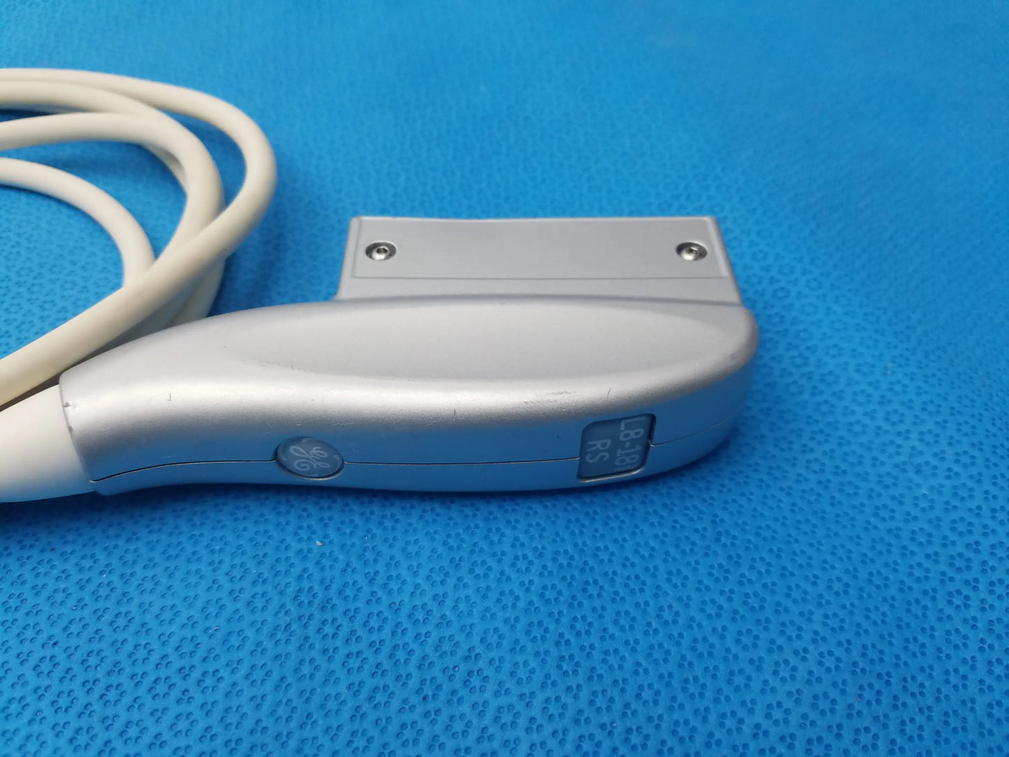 Silver-colored ergonomic ultrasound transducer probe with attached white cable compatible ge healthcare model L8-18i-RS ref 5393197