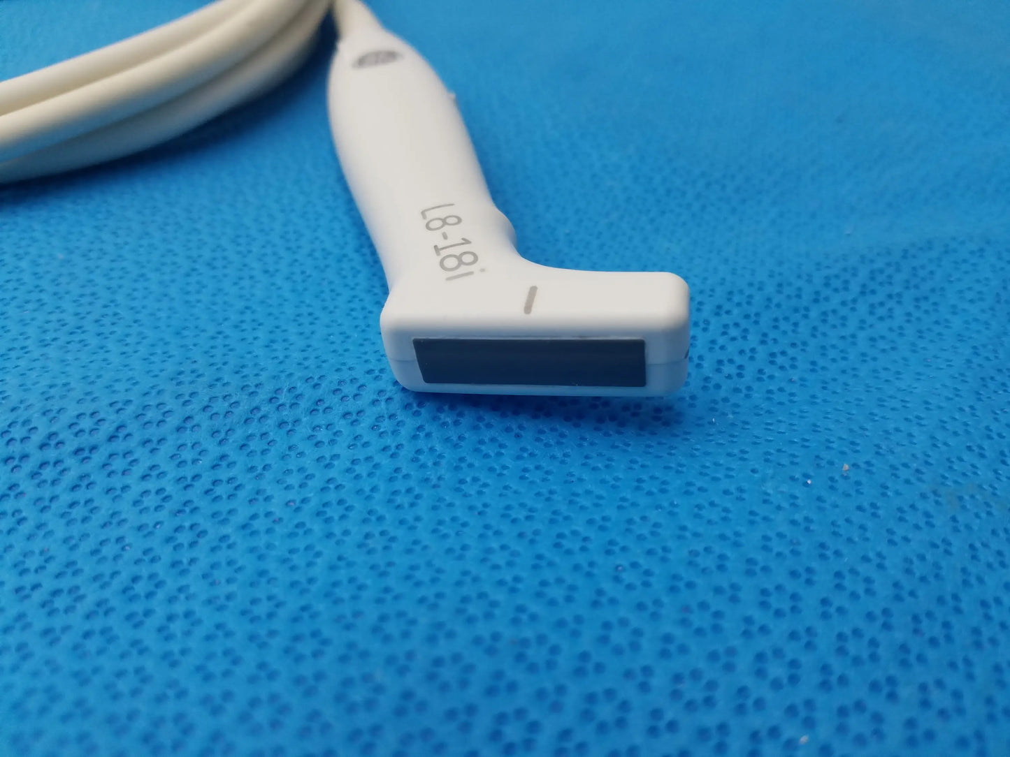 White GE Healthcare L8-18i-RS ultrasound transducer probe with ergonomic handle and rectangular sensor window compatible GE Healthcare