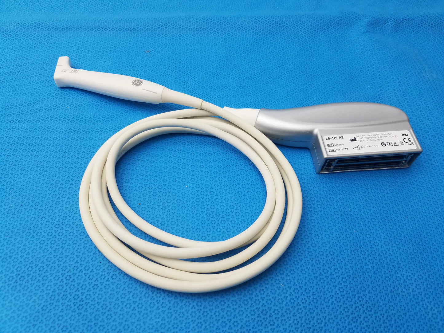 White and silver compatible GE Healthcare ultrasound transducer probe L8-18i-RS with coiled cable and ergonomic design