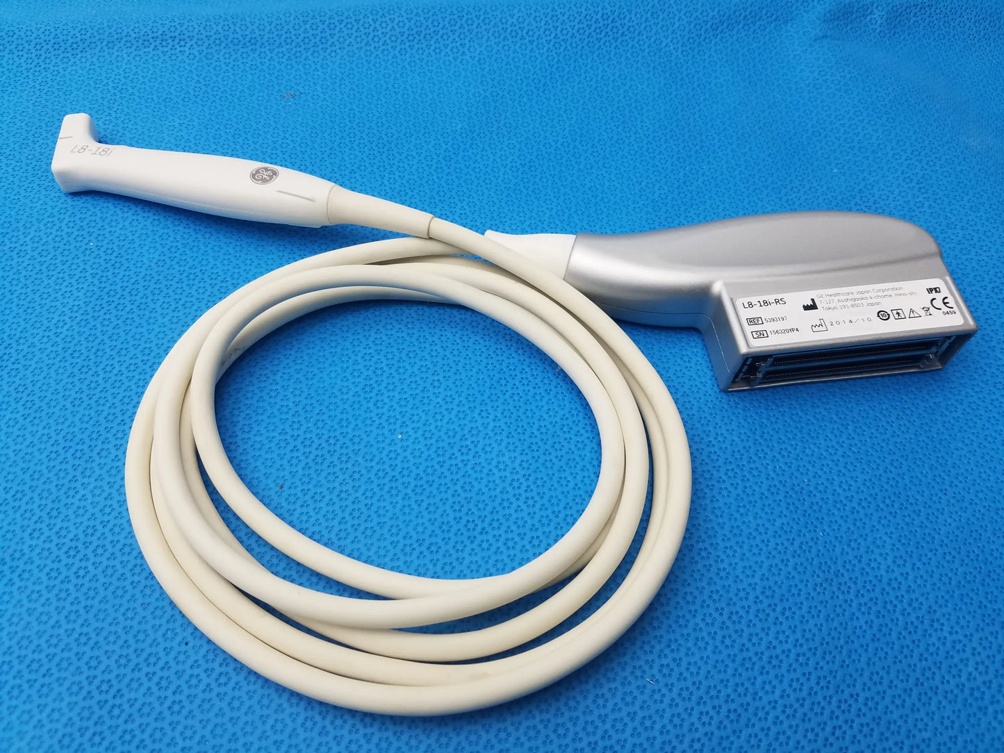 White and silver GE Healthcare L8-18i-RS ultrasound transducer probe with coiled beige cable compatible ge healthcare