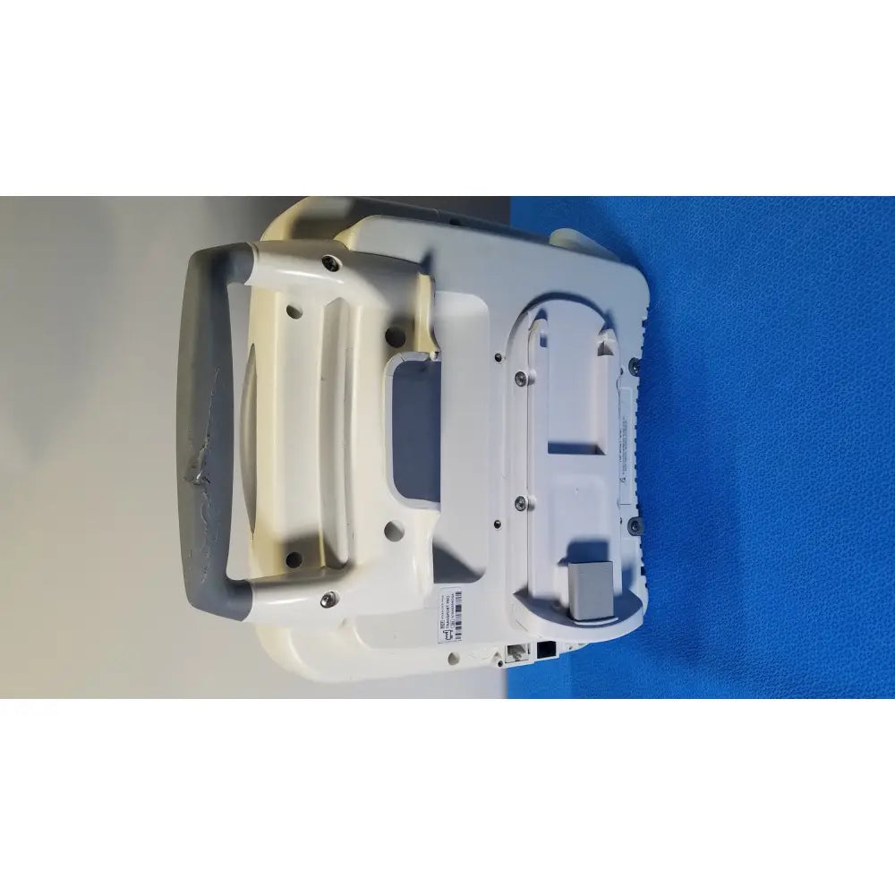 White and gray healthcare transport pro patient monitor with molded plastic casing, integrated handles, and screw compartments