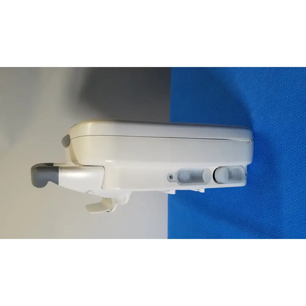 White plastic wall-mounted GE Healthcare Transport Pro patient monitor with gray accents and two circular transparent windows