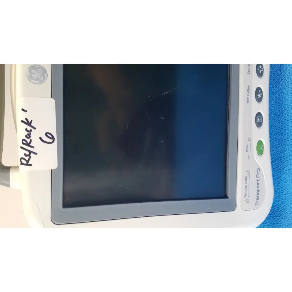 White ge healthcare transport pro patient monitor with gray bezel and dark screen for medical monitoring