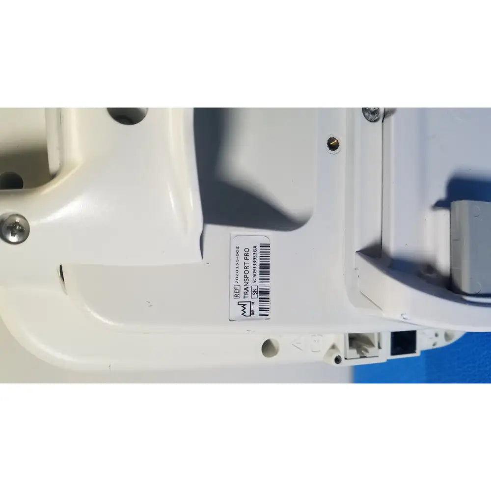 White plastic healthcare transport pro patient monitor casing with barcode label and screw fastenings back side view