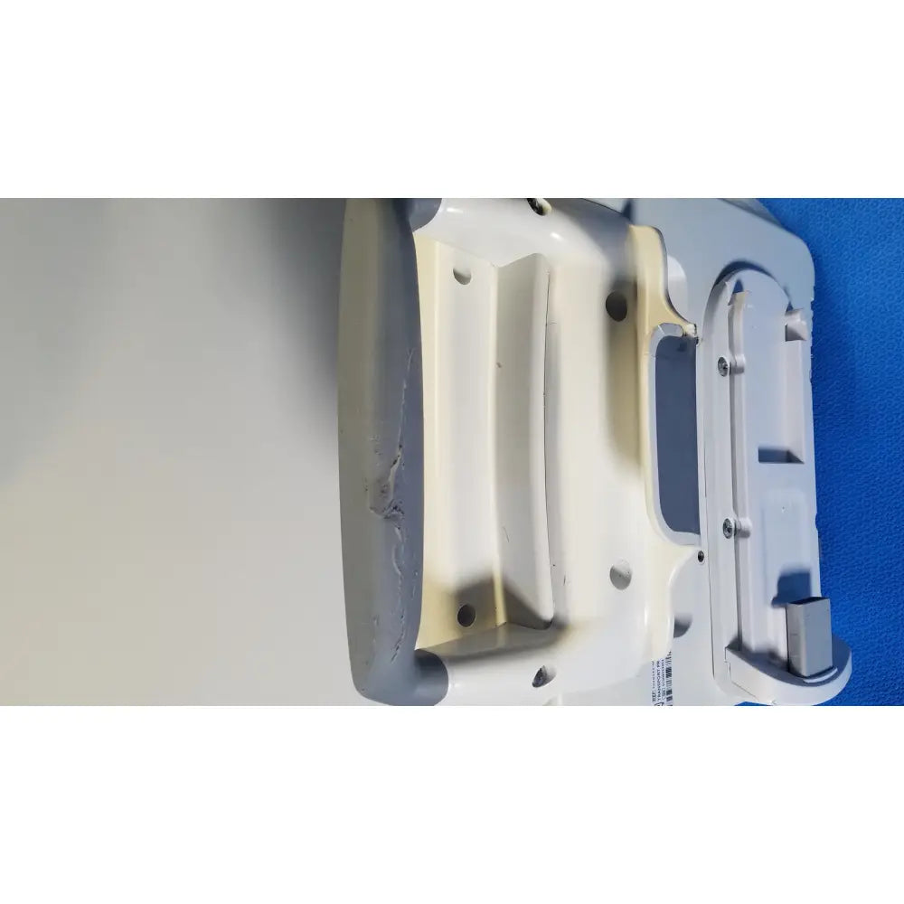Gray and white plastic healthcare transport pro patient monitor with textured grip and visible screws molded compartments