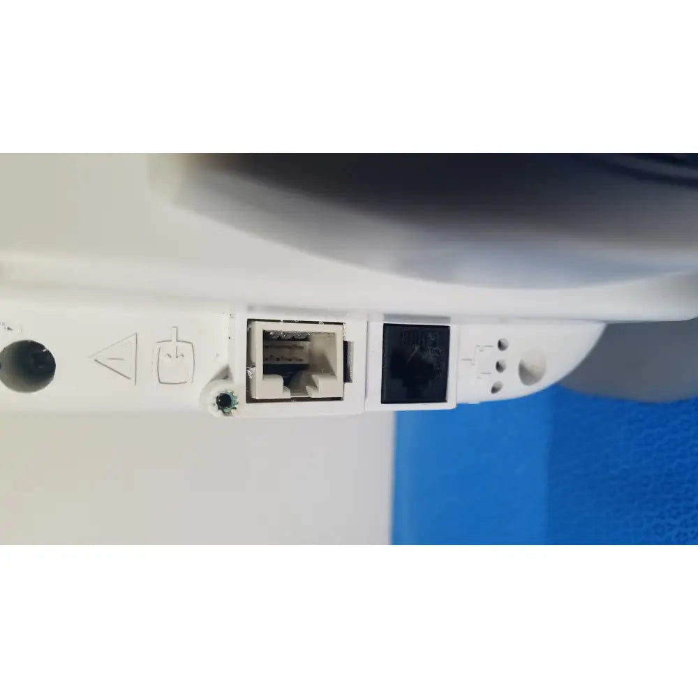 White plastic network port panel with two ethernet ports on the back of ge healthcare transport pro patient monitor