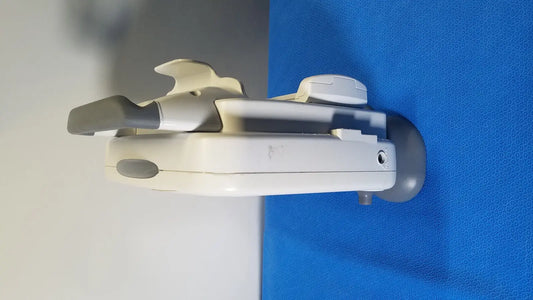 White and gray plastic wall-mounted child safety gate with curved design for ge healthcare transport pro patient monitor