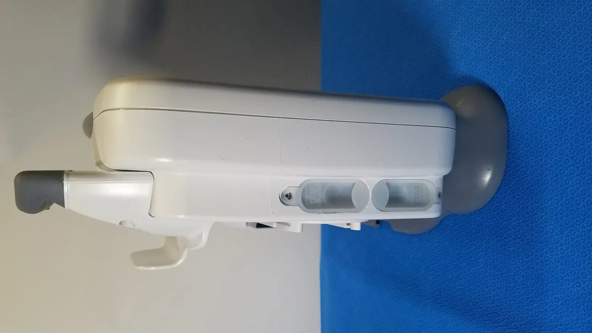 White plastic healthcare transport pro patient monitor with gray accents and two circular side openings