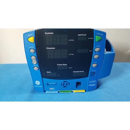 Blue GE Healthcare V180-JBAC-AXAA-XX vital signs monitor with digital display showing vital signs readings