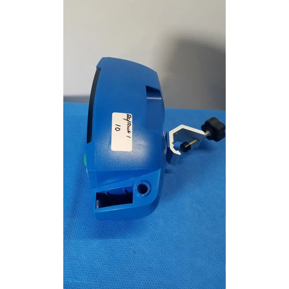 Blue plastic surgical instrument with black knob and white clamp attachment for ge healthcare v180-jbac-axaa-xx vital signs monitor